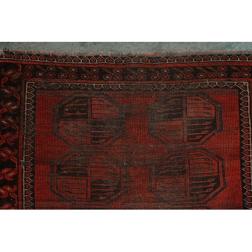 972 - A antique red Afghan Bokhara rug, 194cm x 101cm