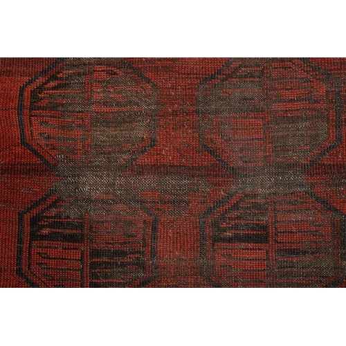 972 - A antique red Afghan Bokhara rug, 194cm x 101cm