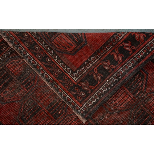 972 - A antique red Afghan Bokhara rug, 194cm x 101cm