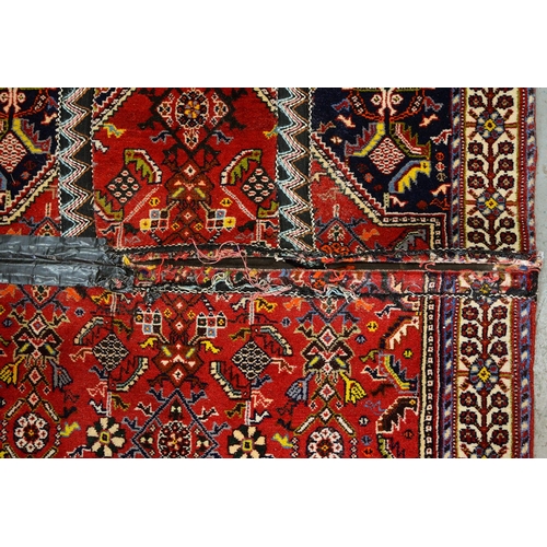 975 - A Qashqai rug, 188cm x 84cm and a Wilton rug, 120cm x 59cm