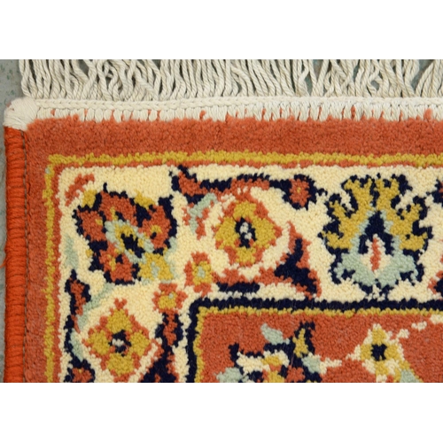 975 - A Qashqai rug, 188cm x 84cm and a Wilton rug, 120cm x 59cm