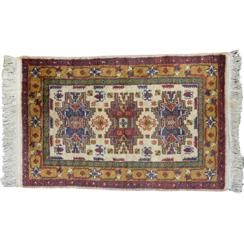 976 - A Turkish Cicim rug, 84cm x 59cm and a Turkish Dagestan rug 90cm x 60cm (2)