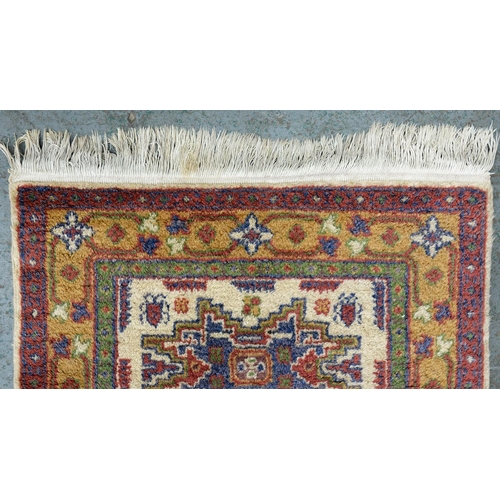 976 - A Turkish Cicim rug, 84cm x 59cm and a Turkish Dagestan rug 90cm x 60cm (2)