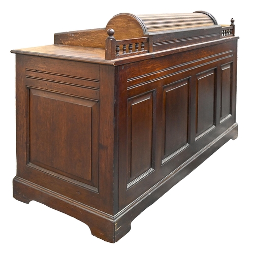 980 - An Edwardian oak desk, with four raised and fielded panels to the back, the galleried top surmounted... 