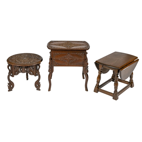 982 - An Indian carved wood low table, early 20th c, on three snake legs, 37cm h; 41cm diam, a contemporar... 