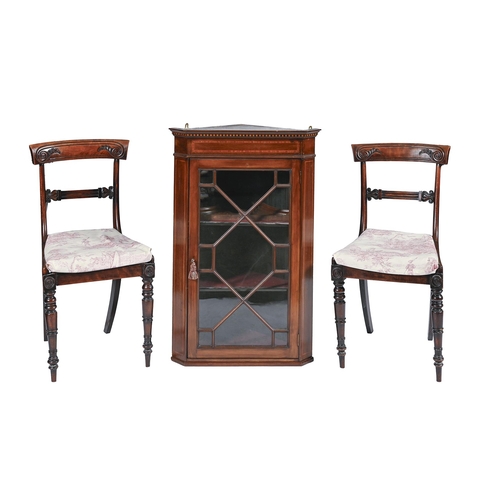 997 - A pair of George IV grained rosewood dining chairs, carved with volutes on turned legs, the seats or... 