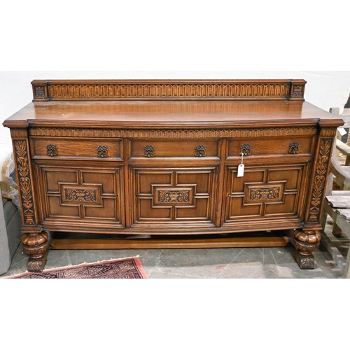 1040 - An oak sideboard, c1930, with geometric mouldings and brass drop handles, 104cm h; 61 x 178cm... 