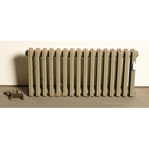 1113 - An iron basket grate and fleur de lys fireback, 49cm l and a cast iron radiator and feet, 42cm h, 98... 