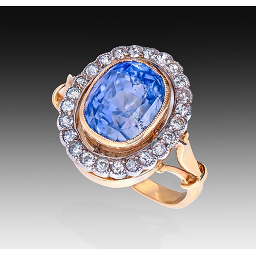 185 - A sapphire and diamond ring, early 20th c, the cushion shaped sapphire of approximately 10.55 x 12.3... 