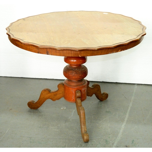 991 - A Continental walnut tripod table, 19th c, the round top with wavy edge on red stained pillar a... 