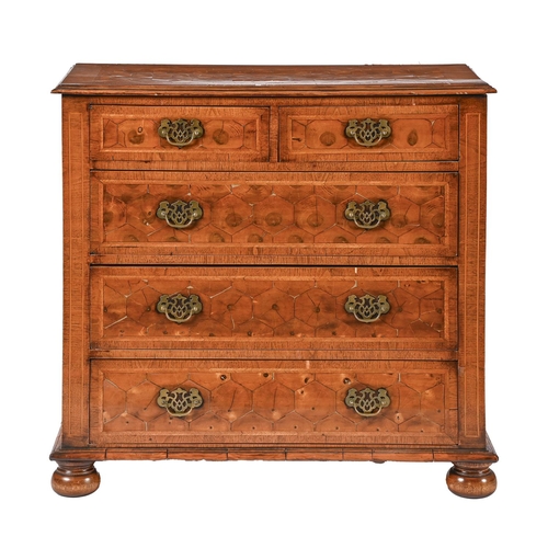 1017 - A walnut, featherbanded and oyster olive wood chest of drawers and pair of bedside cupboards en suit... 