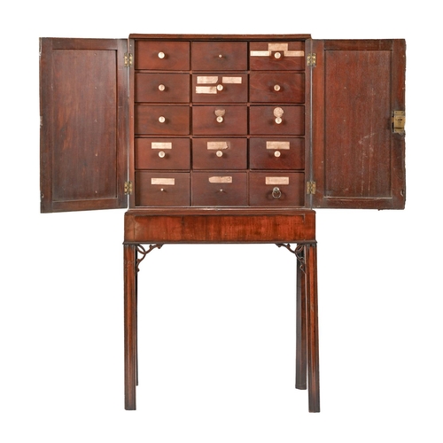 1039 - A George III mahogany apothecary's cabinet, late 18th/early 19th c, the interior fitted with fifteen... 