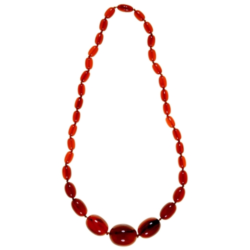 169 - A necklace of faturan beads, 79g