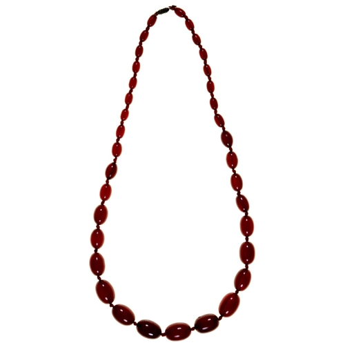 170 - A necklace of faturan beads, 74g