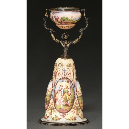 247 - A Viennese silver gilt and painted enamel wager cup, early 20th c, in the form of a woman, her skirt... 