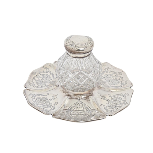 279 - A Victorian silver mounted cut glass inkwell and stand, engraved with foliate scrolls and inscribed ... 