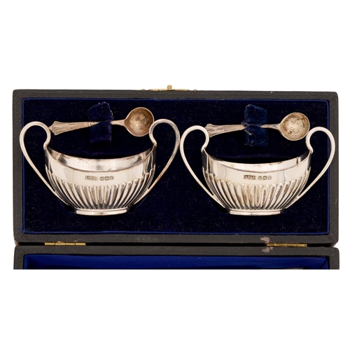 300 - A pair of Victorian silver salt cellars, with loop handles, 83mm l, by James Dixon & Sons Ltd, S... 