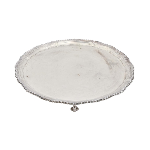 316 - An Elizabeth II silver salver,  with gadrooned rim, on four volute feet, 31cm diam, Roberts & Be... 