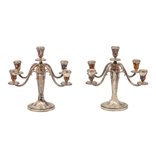 325 - A pair of Dutch silver candelabra, second quarter 20th c, of five lights with scrolling branches, 30... 