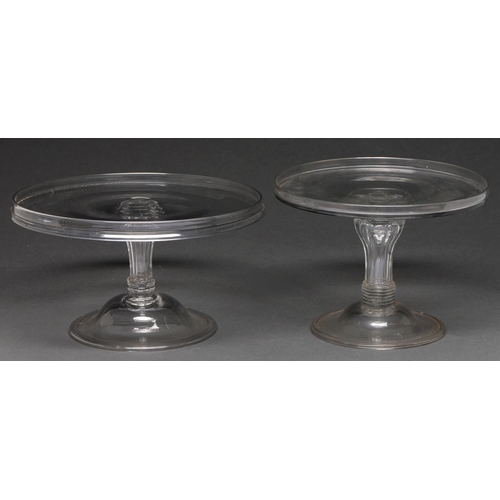 554 - Two English glass salvers, mid 18th c, with moulded pedestal stem on domed and folded foot, 17 and 1... 