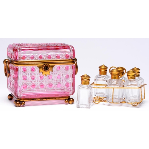 564 - A French gilt lacquered brass mounted pink flashed and cut glass scent casket and set of six square ... 