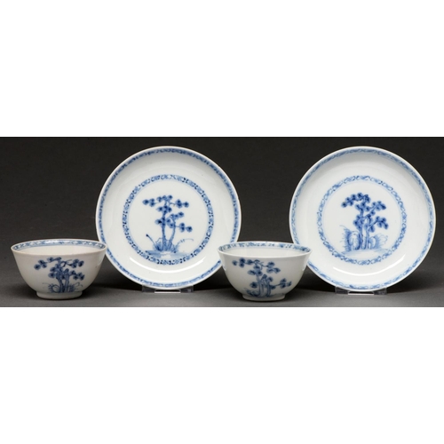 589 - Nanking Cargo. Two blue and white tea bowls and saucers, c1750, painted with the 'Blue Pine' pattern... 