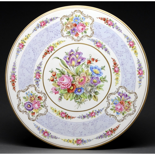 596 - A German porcelain plaque, second half 20th c, decorated with flowers in lavender and gilt border, 4... 