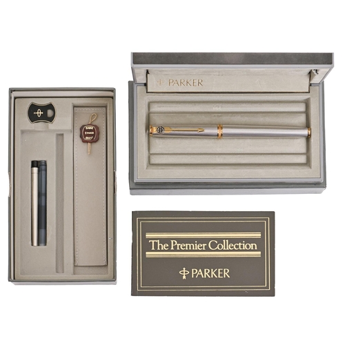 636 - A Parker gold and silver plated fountain pen, marked on gold nib PARKER FRANCE 18K, maker's grey sue... 