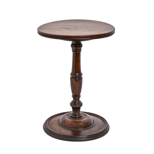 695 - A George III mahogany stand, on turned pillar, the revolving top mounted with brass collar, 34cm h, ... 