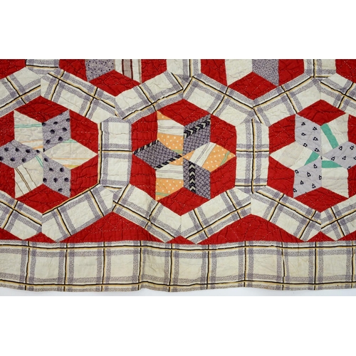 781 - Folk Art. A patchwork quilt, late 19th/early 20th c, worked with six-pointed stars within heptagons ... 