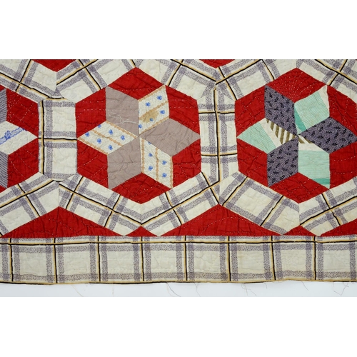 781 - Folk Art. A patchwork quilt, late 19th/early 20th c, worked with six-pointed stars within heptagons ... 