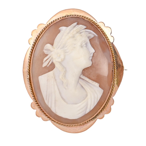 89 - A cameo brooch, the oval shell carved with the head of a woman, gold mount, 47mm, marked 9ct, 8.5g... 