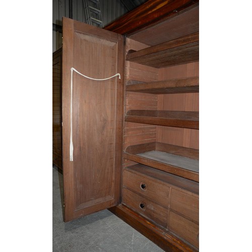 1043 - A Victorian mahogany wardrobe, with low arch panelled doors, 198cm h; 61 x 193cm