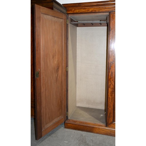 1043 - A Victorian mahogany wardrobe, with low arch panelled doors, 198cm h; 61 x 193cm