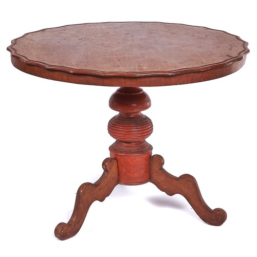 996 - A Continental walnut tripod table, 19th c, the round top with wavy edge on red stained pillar and th... 