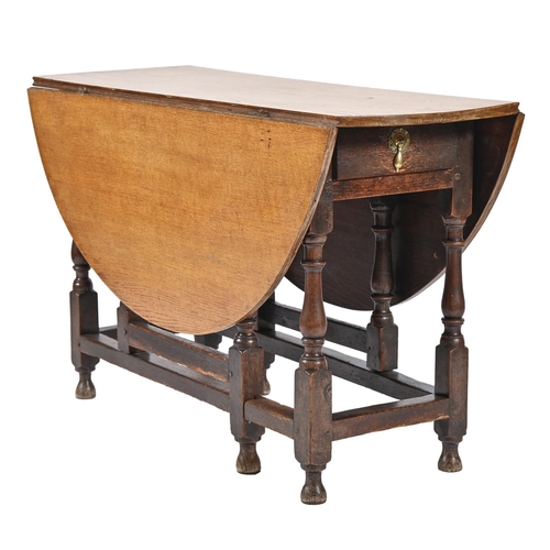 1028 - An oak gateleg table, 18th c, with associated light oak top, 73cm h; 119 x 132cm