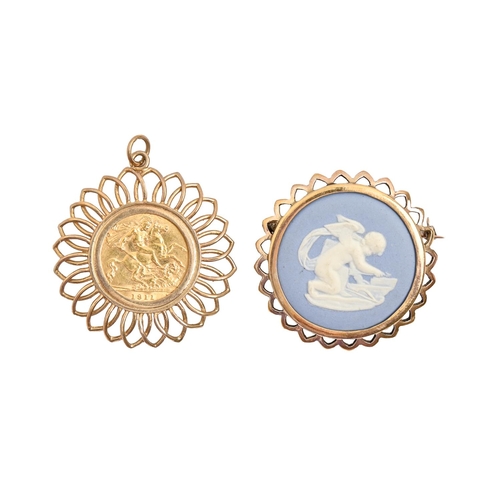 137 - Gold coin. Half sovereign 1911, mounted in 9ct gold flower shaped pendant, 36mm diam, 8.4g and a Wed... 