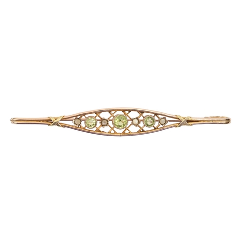 159 - A peridot and split pearl trellis bar brooch,  in gold, 76mm, marked 9ct, 3.7g