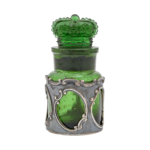 260 - An Edwardian pierced silver bottle sleeve and contemporary moulded green glass bottle and crown stop... 