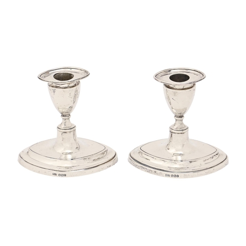 306 - A pair of Edwardian silver dwarf candlesticks, nozzles, 11cm h, by Thomas A Scott, Sheffield 1909, l... 