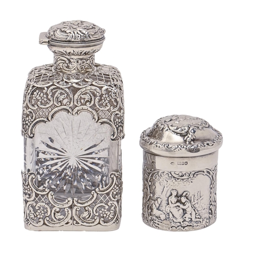 307 - An Edwardian silver mounted cut glass cologne bottle, with die stamped silver trellis and domed... 