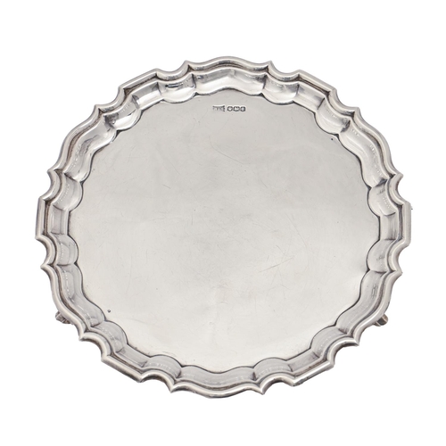 317 - A George V silver salver, on three volute feet, 20.5cm diam, by Walker & hall, Sheffield 1926, 1... 