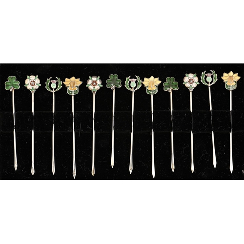 319 - A set of twelve silver and enamel cocktail sticks, mid 20th c, with rose, thistle, shamrock or daffo... 