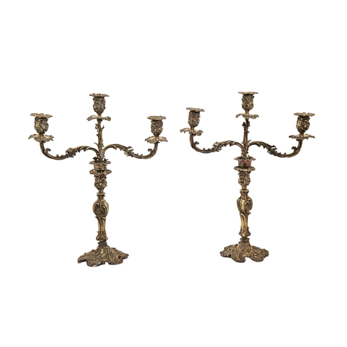 333 - A pair of Victorian EPNS candelabra, of three lights on leafy scrolling openwork branches and rococo... 