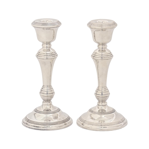 365 - A pair of Elizabeth II silver candlesticks, 20cm h, by W I Broadway & Co, Birmingham 1965, loade... 