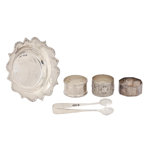 367 - Three silver napkin rings, including a South East Asian example, a silver dish and a pair of sugar t... 