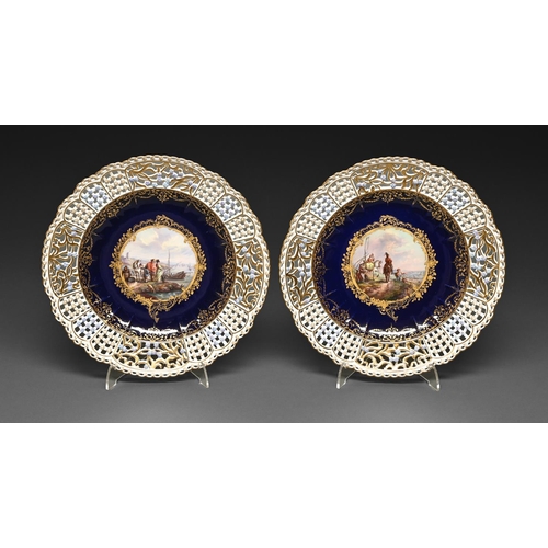 383 - A pair of Meissen plates, late 19th c, painted to the centre with figures on the shore or a cavalier... 