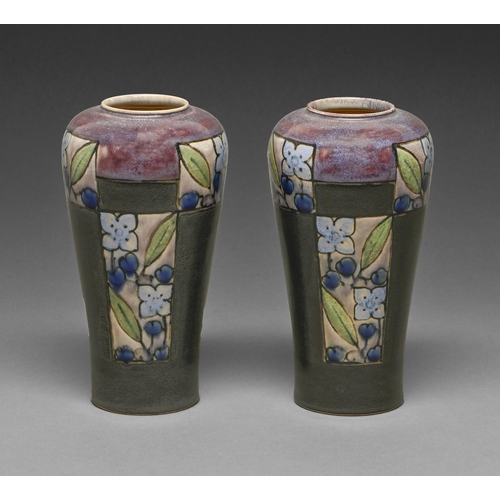 384 - A pair of Doulton Ware vases, early 20th c, decorated with panels of stylised flowers beneath high f... 