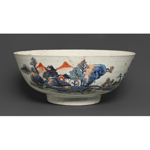 439 - A Chinese blue and white punch bowl with 'clobbered' decoration, late 18th c, painted with landscape... 