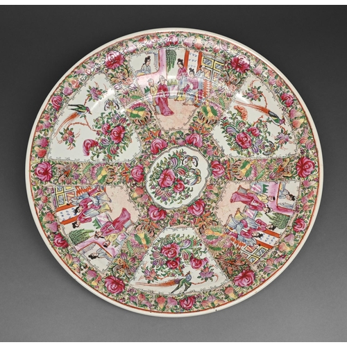 440 - A Chinese Canton famille rose dish, early 20th c, with fan shaped panels of scenes alternating with ... 